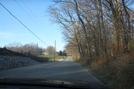 Round objects & motor vehicles (in neutral) appear to roll uphill on Gravity Hill, just west of Mooresville.